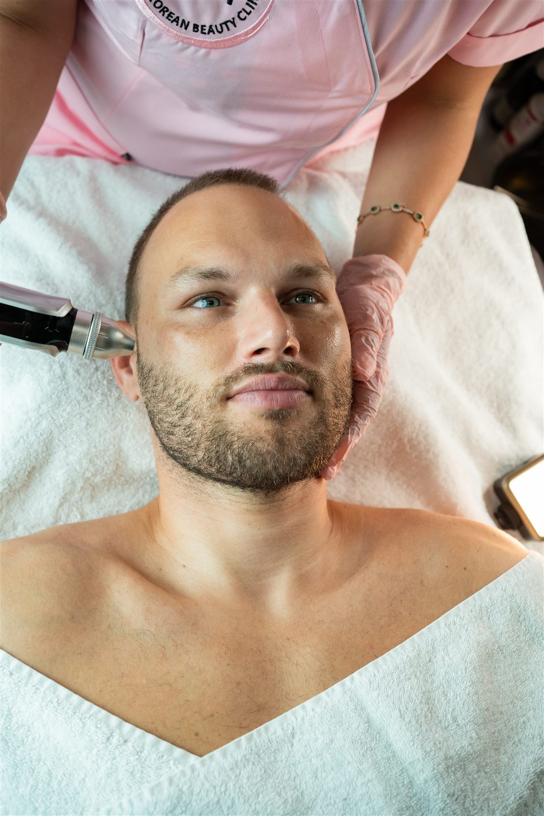 Male client with natural skin texture during personalised facial care