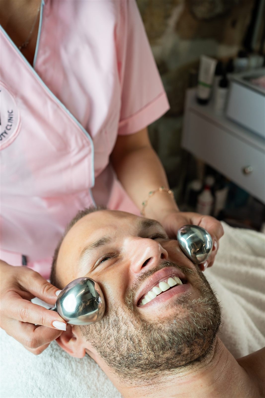 Personalised facial care for a smiling male client